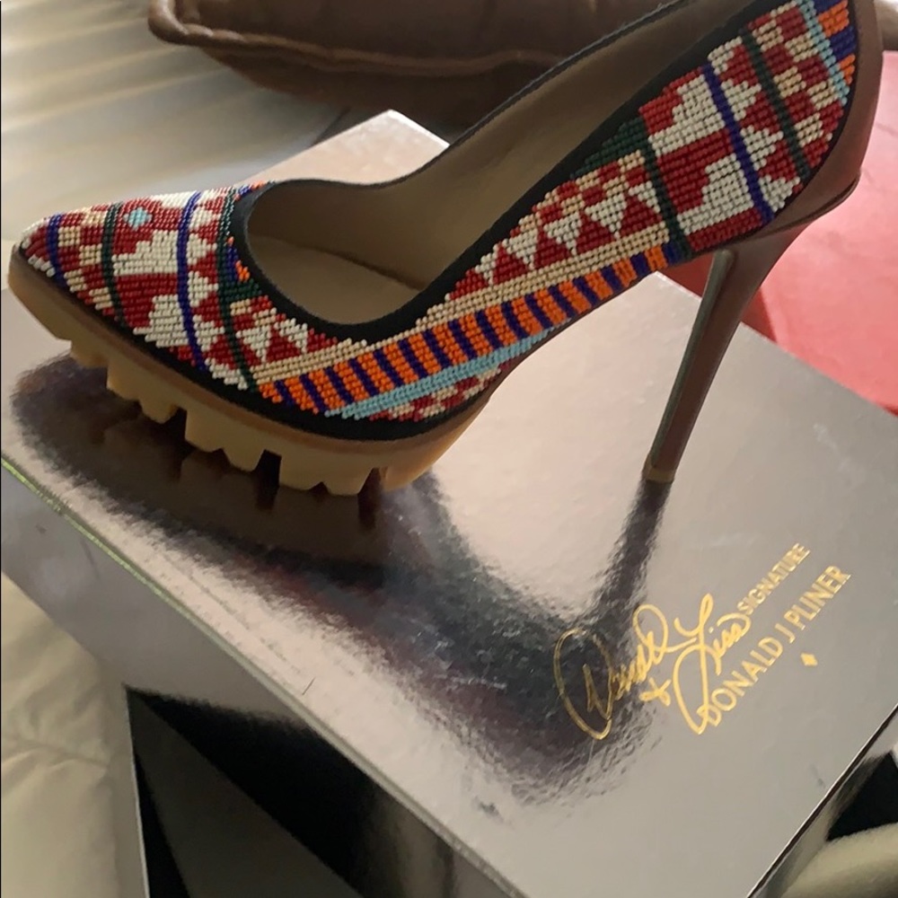 Heels worn once individually beaded by hand